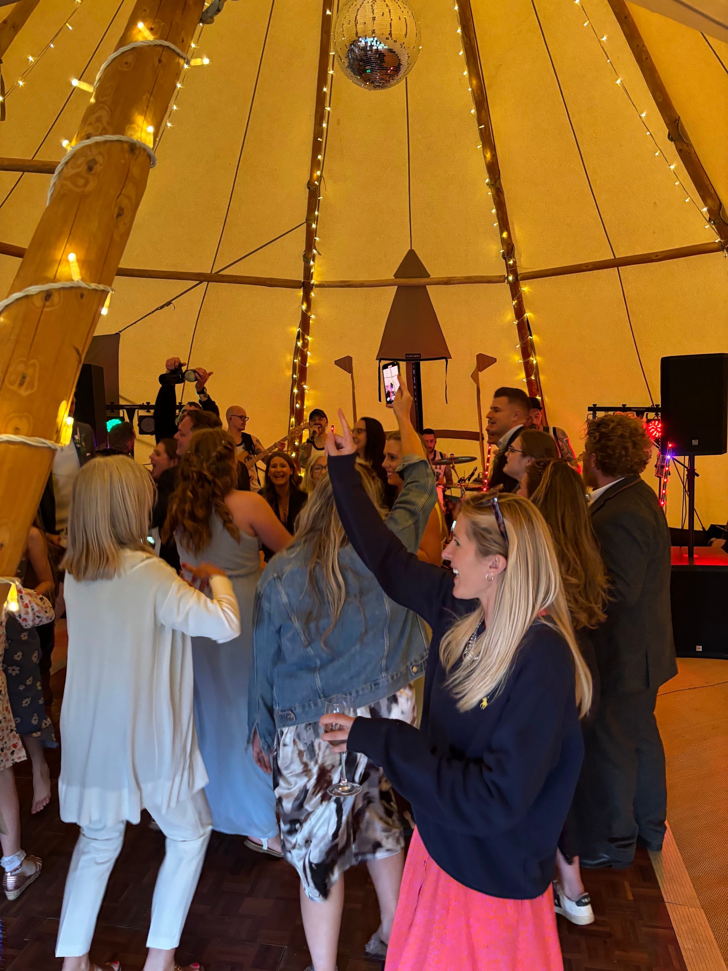 Hands in the air on a tipi dancefloor